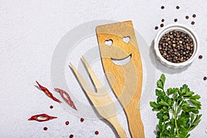 Culinary background with wooden kitchen utensil, spices and herbs. Set for preparation healthy food