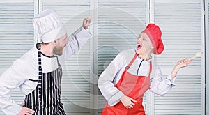 Culinary battle concept. Woman and bearded man culinary show competitors. Ultimate cooking challenge. Culinary battle of