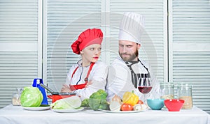 Culinary battle concept. Woman and bearded man culinary show competitors. Who cook better. Ultimate cooking challenge