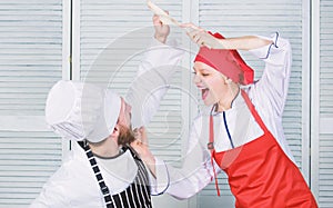 Culinary battle of two chefs. Couple compete in culinary arts. Kitchen rules. Who cook better. Culinary battle concept