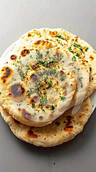 Culinary delight Naan, an isolated serving of delectable Indian bread