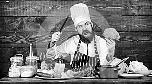 Culinary recipe concept. Man bearded hipster cooking fresh vegetables. Freshest possible ingredients. Chef use fresh