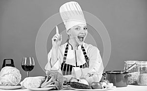 Culinary skills. Woman chef wear hat apron near table ingredients. Girl adorable chef teach culinary. Best culinary