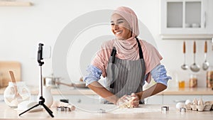 Culinary Vlog. Happy Islamic Woman Recording Video While Baking In Kitchen