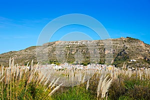 Cullera mountain with white sign writted on in