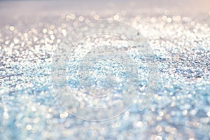 Cullet, background of glass granules, bokeh and glitter