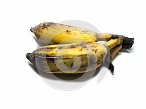 Cultivated banana on the white background Isolated & clipping part. The yellowish and black color is caused by the old banana