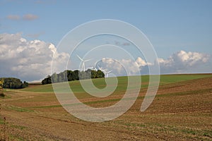 Cultivated field and wind turbine in Champagne