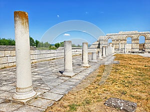 Cultural heritage of the Romans concept. Ancient Roman Atrium with columns and walls with Mosaic Floor photo