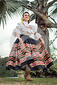 Cultural heritages today. Latin woman with typical Colombian dance costume. photo