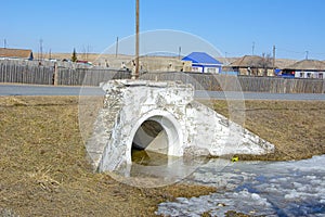 Culvert located under the road. Russia