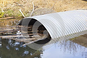 Culvert Pipe Under Road From Stream Oxbow in Park