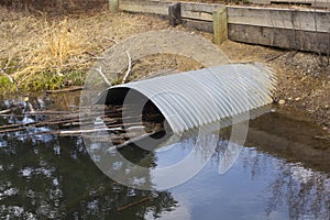 Culvert Pipe Under Road From Stream Oxbow in Park