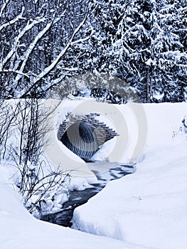 Culvert and stream in winter
