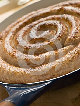 Cumberland Sausage Coil in a Frying Pan