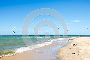 Several kite surfing on the air at the Cumbuco