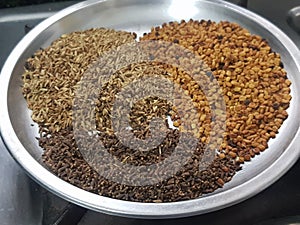 Cumin or caraway and fenugreek seeds isolated on black background. Top view