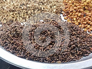 Cumin or caraway and fenugreek seeds isolated on black background. Top view