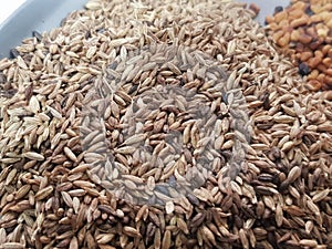 Cumin or caraway seeds isolated on black background. Top view