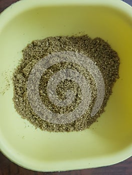 Cumin or caraway seeds powder isolated on black background. Top view