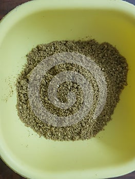 Cumin or caraway seeds powder isolated on black background. Top view