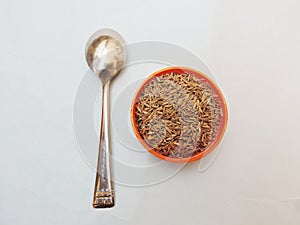 Cumin seeds in isolated white background. photo