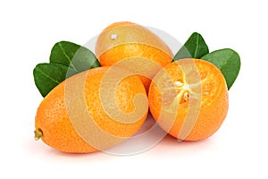 Cumquat or kumquat with leaf isolated on white background close up photo