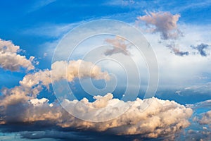 cumuli clouds in dark blue sky in summer evening