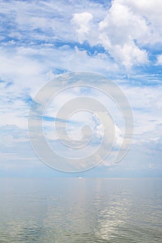 Cumuli white clouds and calm water Sea of Azov