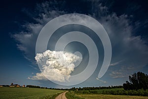 Cumulonimbus capillatus incus cloud, isolated storm cloud