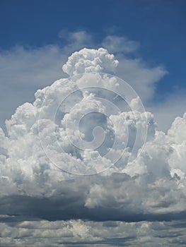 Cumulonimbus cloud formations on tropical blue sky