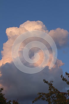 Cumulonimbus cloud over clean blue sky in summer