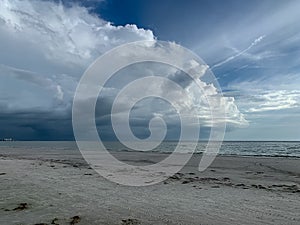 Cumulonimbus storm cloud hovering over Gulf of Mexico