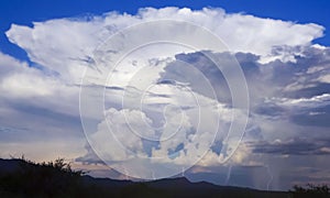 A Cumulonimbus Thundercloud and Five Lightning Strikes