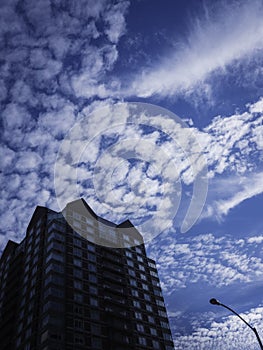 Cumulous Clouds over the Silhouette Building