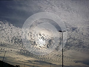 Cumulous clouds and sunset, a view from the road