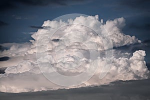 Cumulus cloud forming the storm at sunset