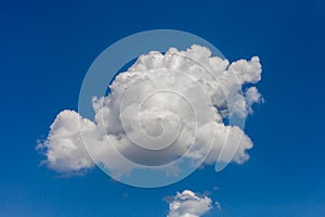 Cumulus clouds against a bright blue sky