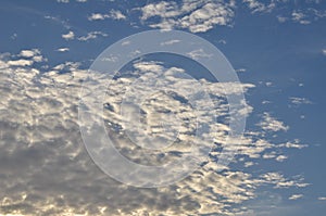 Cumulus clouds on blue sky photo