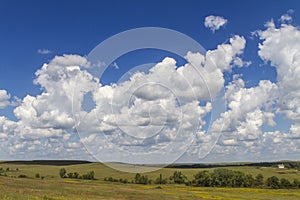 Cumulus clouds, blue sky, Kansas landscape