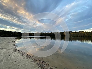 Cumulus clouds in the blue sky, reflexion