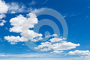 Cumulus clouds in blue sky, white fluffy clouds floating in blue sky