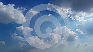 Cumulus clouds covering blue sky during bright sunny summer day, timelapse