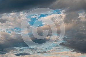 Cumulus clouds and gaps of clear blue sky