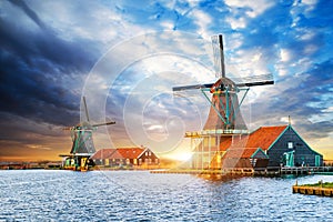 Cumulus clouds on sunset over dutch windmills in Rotterdam. Neth photo