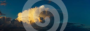 cumulus and cumulonimbus clouds at sunset photo