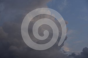 Cumulus rain clouds in the evening sky. Thunderclouds