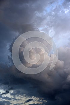 Cumulus rain clouds in the evening sky. Thunderclouds