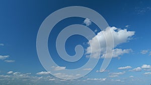 Cumulus with stratocumulus clouds flying slowly on beautiful blue sky horizon background. Timelapse.