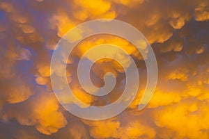 Cumulus and Stratus clouds in dramatic sunset sky over Cape Town